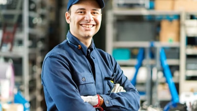 man facing camera with arms crossed.