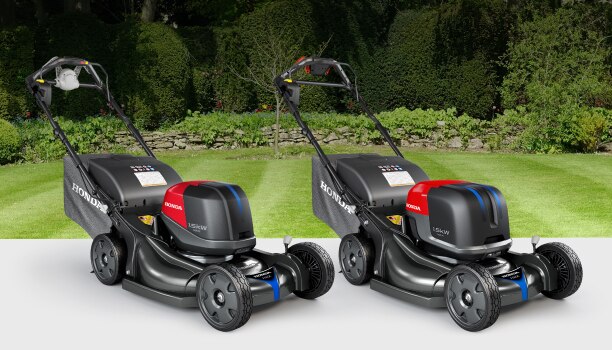 A Honda HRX-BV and the HRX-BE on a grass background.