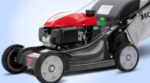 Medium wide view of a Honda lawn mower on white space.  