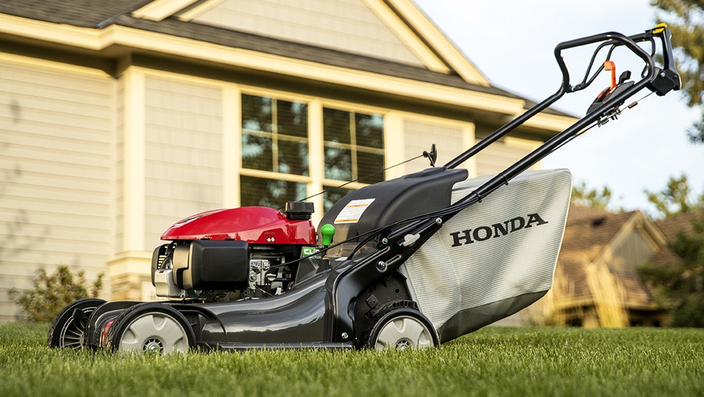 Close up view of a lawn mower on grass